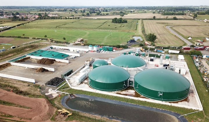 Wardley biogas plant with green digester tanks, aerial view